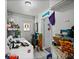 A laundry area with a washer and dryer, storage shelves, a uniquely designed door, and tiled flooring at 5559 17Th N Ave, St Petersburg, FL 33710