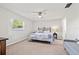 Bright bedroom featuring a window, ceiling fan, and stylish furnishings offering a relaxing retreat at 5834 71St N St, St Petersburg, FL 33709