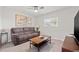 Inviting living room with a comfortable sofa, decorative painting, and natural light from the window at 5834 71St N St, St Petersburg, FL 33709