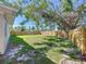 Large, well-maintained backyard enclosed by a wooden fence, offering ample space for relaxation and recreation at 620 43Rd Street W Blvd, Palmetto, FL 34221