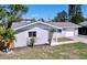 Well-maintained single-story home with an attached garage, manicured front yard, and fresh exterior paint at 620 43Rd Street W Blvd, Palmetto, FL 34221