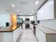 Well-lit kitchen featuring stainless steel appliances, quartz counters, and a butcher block island at 620 43Rd Street W Blvd, Palmetto, FL 34221