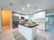 Bright kitchen with stainless steel appliances, ample cabinet space, and a butcher block island at 620 43Rd Street W Blvd, Palmetto, FL 34221