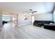 Spacious living room with gray walls, ceiling fan, recessed lighting, and modern flooring at 620 43Rd Street W Blvd, Palmetto, FL 34221