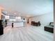 Open-concept living space featuring updated flooring, modern lighting, and freshly painted walls at 620 43Rd Street W Blvd, Palmetto, FL 34221