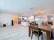 Open-concept living space with dining area, updated flooring, and views of the modern kitchen at 620 43Rd Street W Blvd, Palmetto, FL 34221