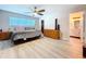 Airy main bedroom with a ceiling fan, closet, and ensuite bathroom at 620 43Rd Street W Blvd, Palmetto, FL 34221