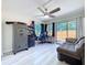 Bright office space featuring a gray workstation, gray sofa, and a backyard view at 620 43Rd Street W Blvd, Palmetto, FL 34221