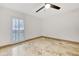 Bright bedroom with travertine floors and a modern ceiling fan at 6906 Summerbridge Dr, Tampa, FL 33634