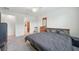 Comfortable bedroom features neutral tones, ceiling fan, and en suite bathroom with walk-in shower at 7580 Pool Compass Loop, Wesley Chapel, FL 33545
