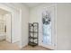 Bright entryway featuring decorative glass door and ceramic tile flooring at 7580 Pool Compass Loop, Wesley Chapel, FL 33545
