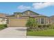 Charming single-Gathering home with a two-car garage and well-maintained landscaping at 7580 Pool Compass Loop, Wesley Chapel, FL 33545