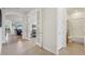 Hallway featuring tile flooring and french doors at 7580 Pool Compass Loop, Wesley Chapel, FL 33545
