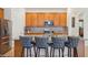 Kitchen island with granite countertop, breakfast bar and stylish seating at 7580 Pool Compass Loop, Wesley Chapel, FL 33545