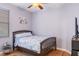 Small bedroom with a single bed and hardwood floors at 8315 Moccasin Trail Dr, Riverview, FL 33578