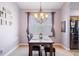 Dining room with wood table, chandelier, and artwork at 8315 Moccasin Trail Dr, Riverview, FL 33578