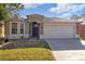 Charming single-story home featuring a well-maintained lawn, brick walkway and a two car garage at 8315 Moccasin Trail Dr, Riverview, FL 33578
