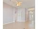 Bright living room with neutral walls, tile floors, and an arched entrance to the foyer at 8315 Moccasin Trail Dr, Riverview, FL 33578