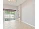 View of a living room with sliding glass doors to the backyard at 8315 Moccasin Trail Dr, Riverview, FL 33578
