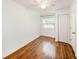 Bedroom with wood floors, closet, ceiling fan and natural light from the window at 8922 Donna Lu Dr, Odessa, FL 33556