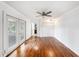 Spacious bedroom with access to deck area, wood floors and a ceiling fan at 8922 Donna Lu Dr, Odessa, FL 33556