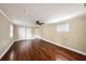 Neutral bedroom with wood laminate flooring and closet space at 8922 Donna Lu Dr, Odessa, FL 33556