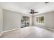 Bright bedroom with sliding glass doors to a patio and large window for natural light at 8922 Donna Lu Dr, Odessa, FL 33556