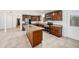 Gourmet kitchen featuring granite countertops, stainless steel appliances and a kitchen island at 8922 Donna Lu Dr, Odessa, FL 33556
