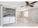 Laundry room area with washer, dryer, and tile floors plus space for folding at 8922 Donna Lu Dr, Odessa, FL 33556