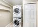 Convenient laundry room with washer, dryer, shelving and storage space at 8922 Donna Lu Dr, Odessa, FL 33556