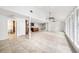 Bright, spacious living room with tile floors, high ceilings, and modern ceiling fans at 8922 Donna Lu Dr, Odessa, FL 33556