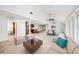 An open-concept living room with a modern kitchen, tile floors, and lots of light at 8922 Donna Lu Dr, Odessa, FL 33556