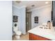 Bright bathroom featuring a double vanity, stylish mirror, and modern shower at 1120 E Kennedy Blvd # 1228, Tampa, FL 33602