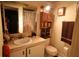 Functional bathroom featuring a vanity, mirrored cabinet, and a toilet at 11723 Raintree Village Blvd # B, Temple Terrace, FL 33617