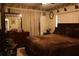 Comfortable bedroom with wood dresser and decorative accents at 11723 Raintree Village Blvd # B, Temple Terrace, FL 33617