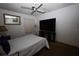 Bright bedroom with a large TV and minimalist decor at 11723 Raintree Village Blvd # B, Temple Terrace, FL 33617