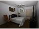 Bedroom featuring ceiling fan, a large window, and simple decor at 11723 Raintree Village Blvd # B, Temple Terrace, FL 33617