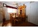 Cozy dining room featuring hardwood floors, a vintage hutch, and natural light at 11723 Raintree Village Blvd # B, Temple Terrace, FL 33617