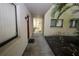 Exterior hallway view showing unit entrances and access along the side of the condo building at 11723 Raintree Village Blvd # B, Temple Terrace, FL 33617