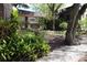 Apartment complex exterior featuring red doors and a balcony at 11723 Raintree Village Blvd # B, Temple Terrace, FL 33617