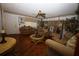 Comfortable living room with parquet floors, ceiling fan, and cozy seating at 11723 Raintree Village Blvd # B, Temple Terrace, FL 33617