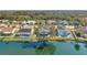 Scenic waterfront homes with screened-in pools and well-maintained landscaping bordering a serene lake at 1204 50Th E St, Bradenton, FL 34208