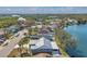 Waterfront homes with lush landscaping along a serene lake surrounded by mature trees in a desirable neighborhood at 1204 50Th E St, Bradenton, FL 34208