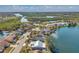 Aerial view of waterfront homes with beautifully landscaped yards and scenic views of the water at 1204 50Th E St, Bradenton, FL 34208