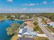 Waterfront community featuring single-Gathering homes on a scenic lake with mature trees and well-maintained landscaping at 1204 50Th E St, Bradenton, FL 34208