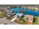 Scenic waterfront homes with lush landscaping along a serene lake surrounded by mature trees in a desirable neighborhood at 1204 50Th E St, Bradenton, FL 34208