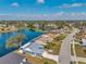 Waterfront community featuring single-Gathering homes on a scenic lake with mature trees and well-maintained landscaping at 1204 50Th E St, Bradenton, FL 34208
