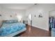 Bright bedroom featuring hardwood floors, closet and adjoining bathroom at 1204 50Th E St, Bradenton, FL 34208