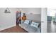 Cozy bedroom featuring hardwood floors and a comfortable couch with adjoining closet at 1204 50Th E St, Bradenton, FL 34208