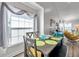 Bright dining room features a large window and seating for six at 1204 50Th E St, Bradenton, FL 34208